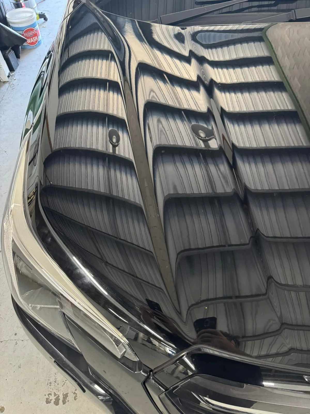 After repair: dark Subaru bonnet left view showing its finished appearance