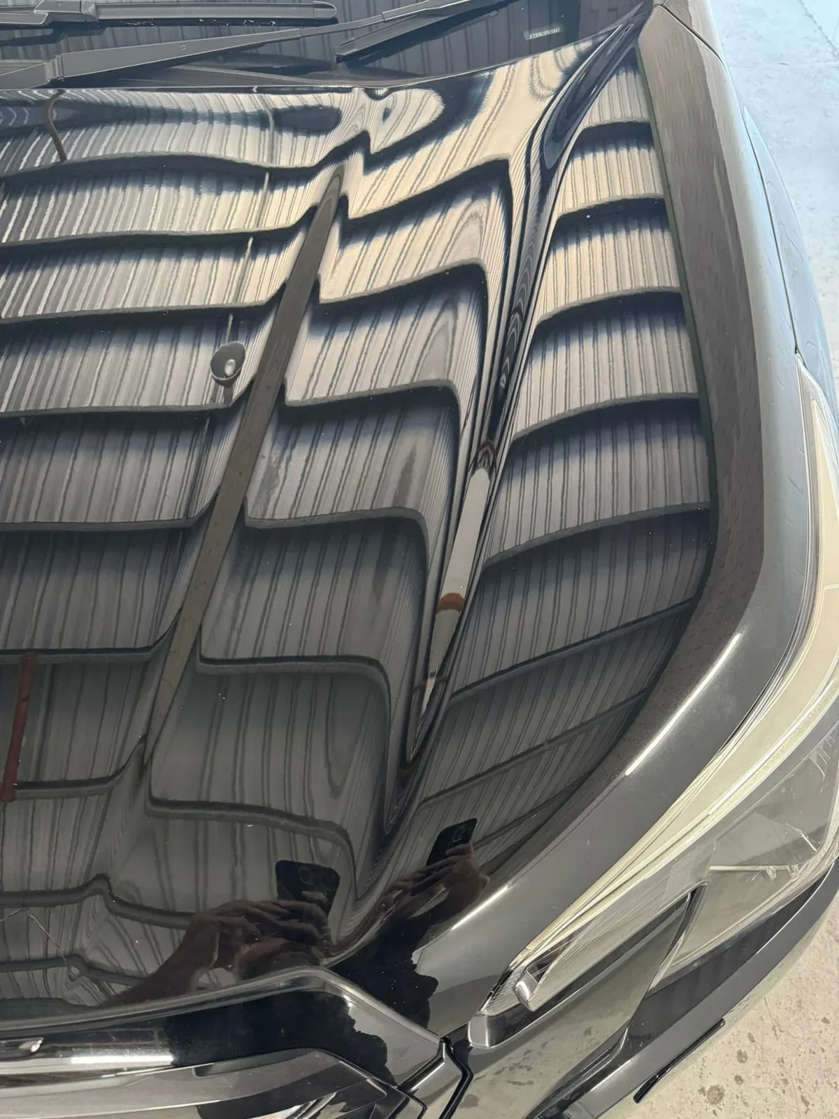 After repair: dark Subaru bonnet right view showing its finished appearance